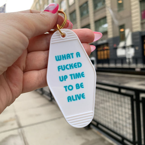 What a Fucked Up Time to Be Alive Motel Style Keychain in White