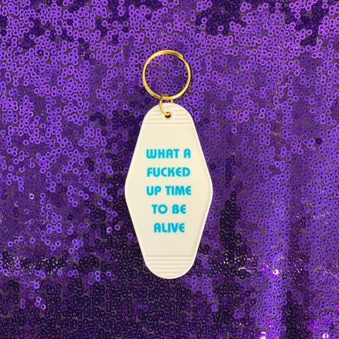 What a Fucked Up Time to Be Alive Motel Style Keychain in White